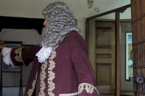 man wearing an old fashioned wig