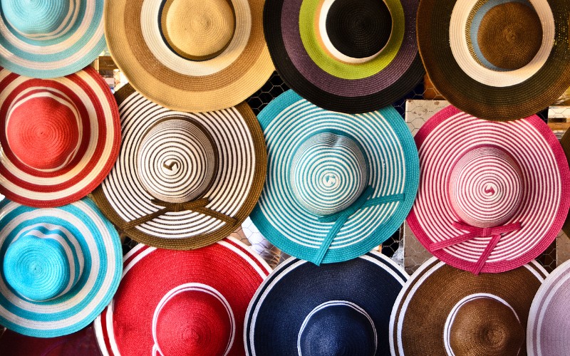 A variety of hats with different colors.