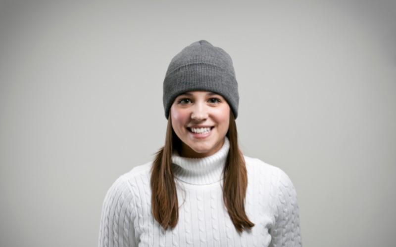 Woman wearing grey winter hat