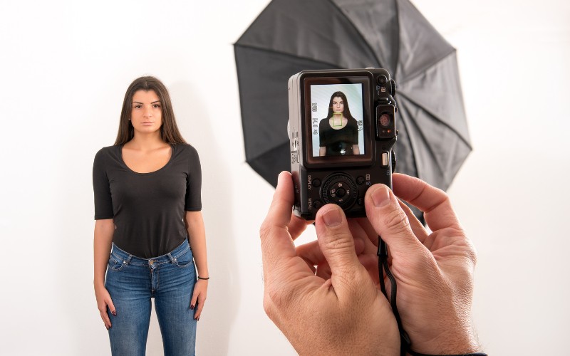 Woman having her passport photo taken