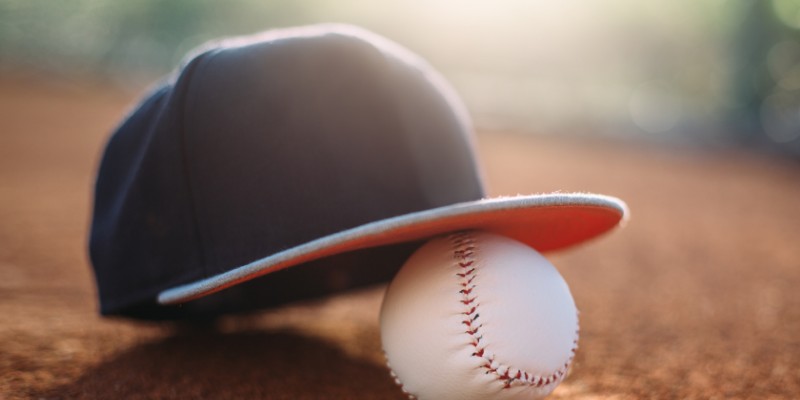 A baseball cap and baseball