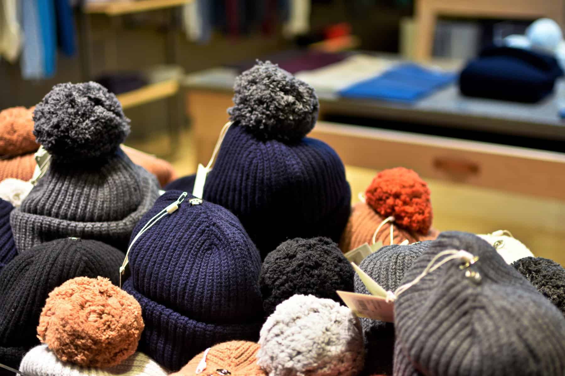 Selection of beanies with pom poms