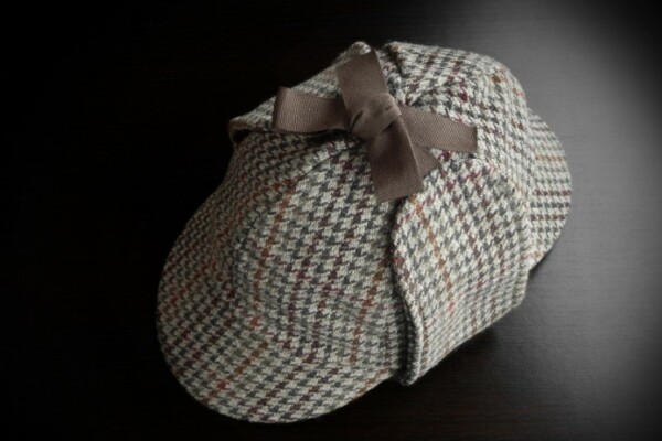 Deerstalker hat on black background