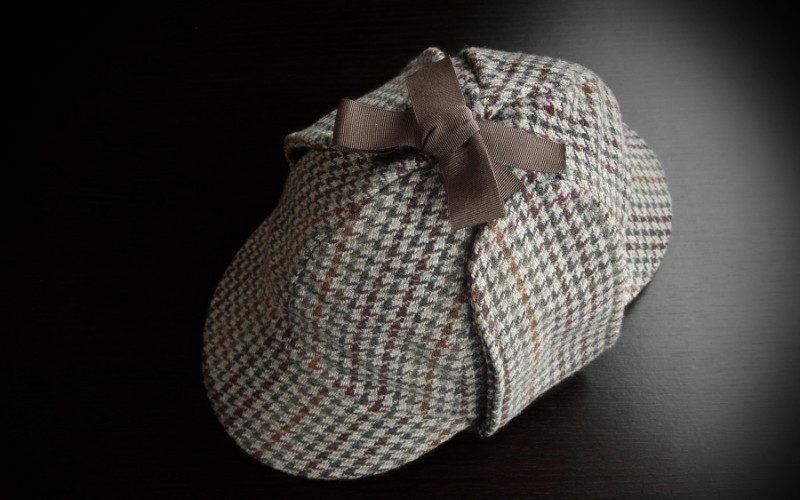 Deerstalker hat on black background