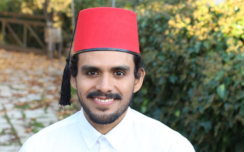 Man wearing a fez hat