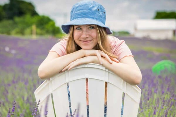 women smiling wearing a bucket hat