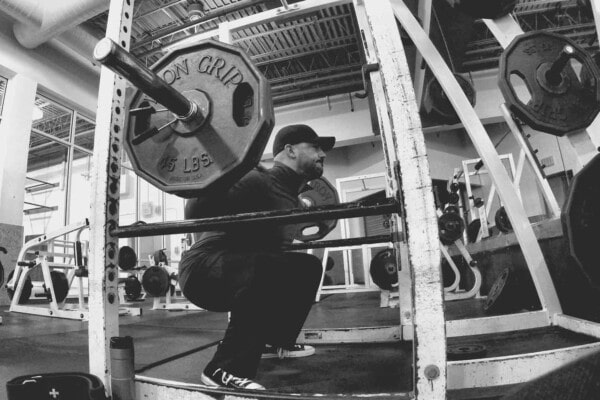 lifting weights wearing a hat