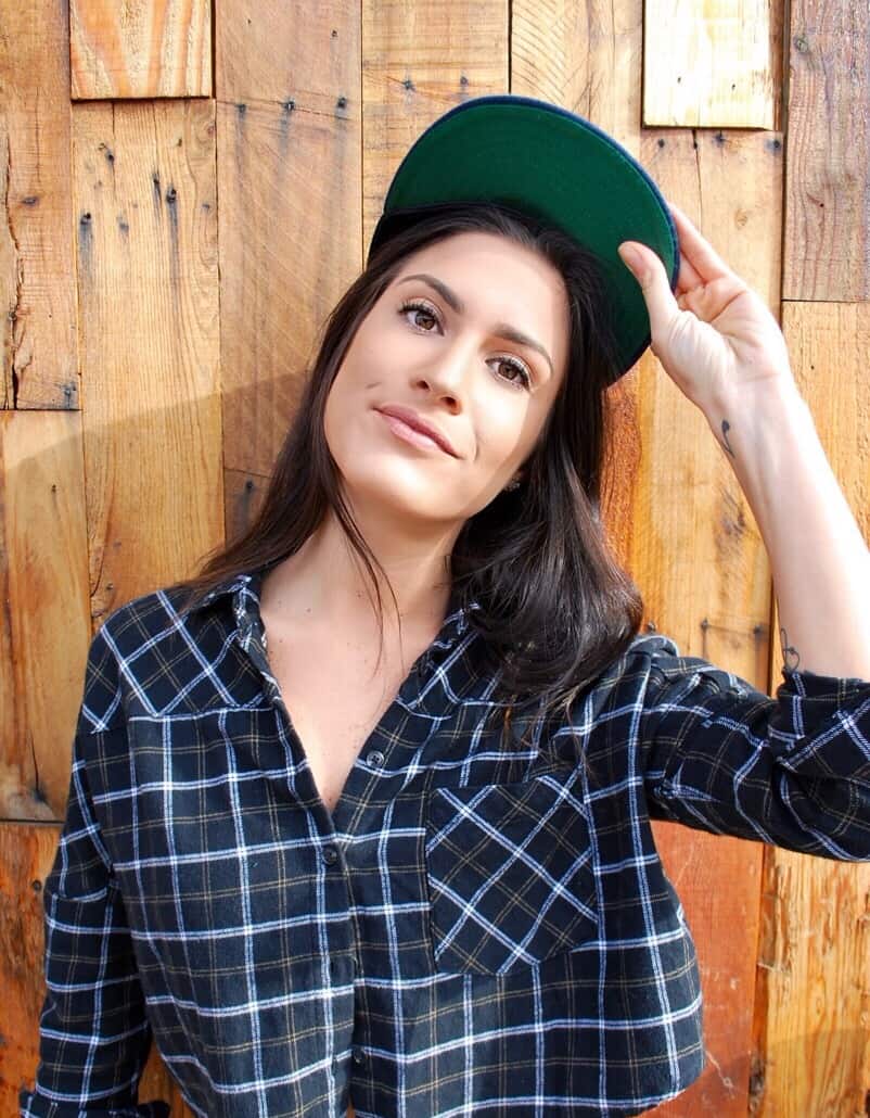 women wearing baseball cap with green brim