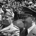 Hitler wearing cap next to Mussolini