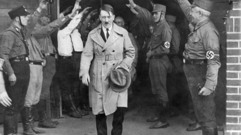 Hitler carrying a hat