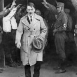 Hitler carrying a hat