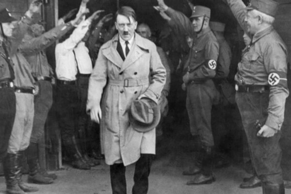 Hitler carrying a hat