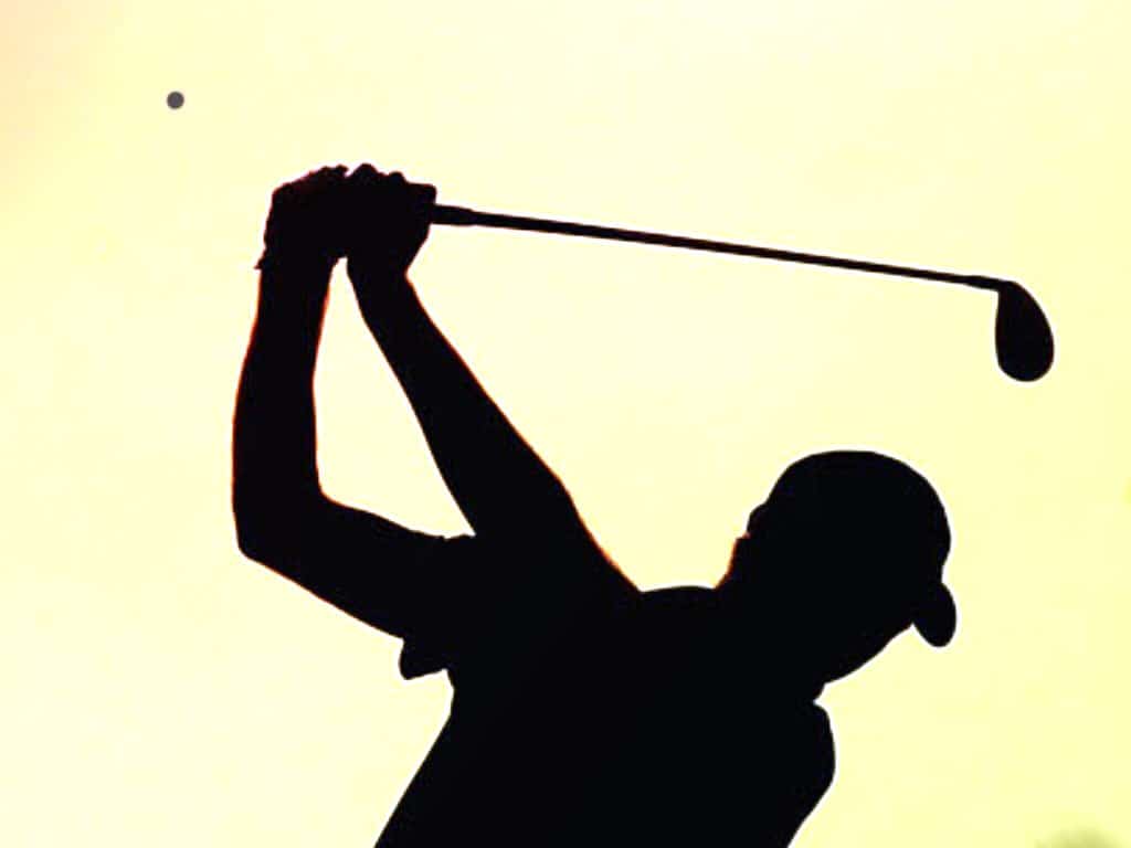 Man playing golf