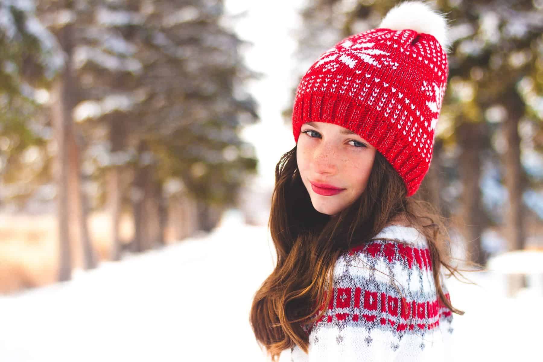 Girl wearing a red winter toque hat