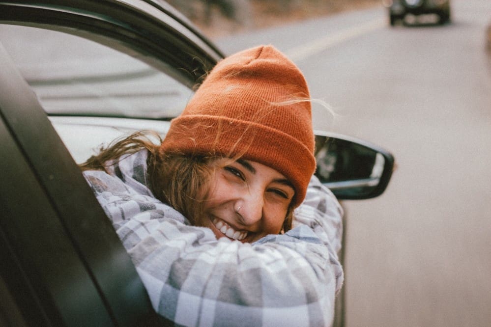 women wearing an orange beanie