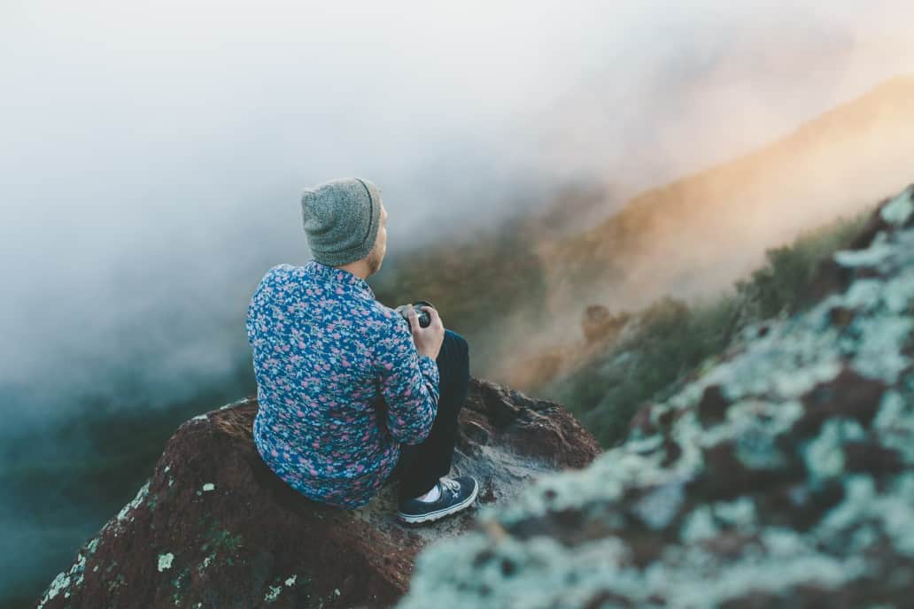 man wearing a beanie on a mountain