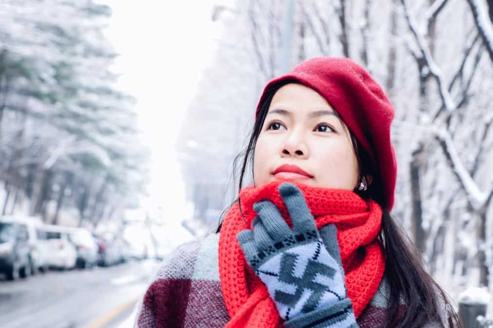 woman wearing red scarf and hat