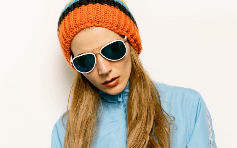 woman wearing a beanie with sun glasses