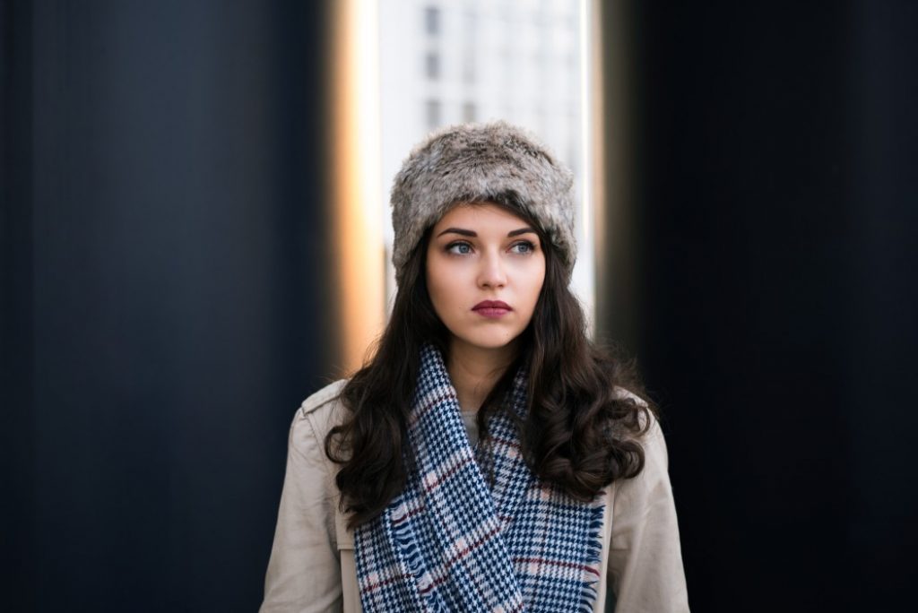 women wear a patterned scarf and hat