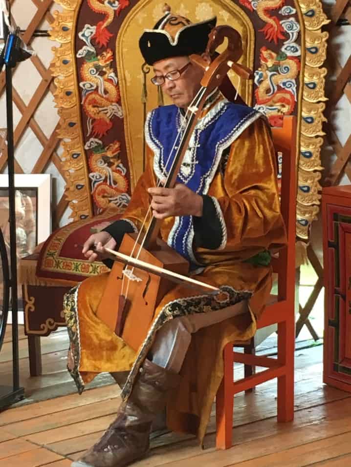 Man wearing traditional Mongolian hat