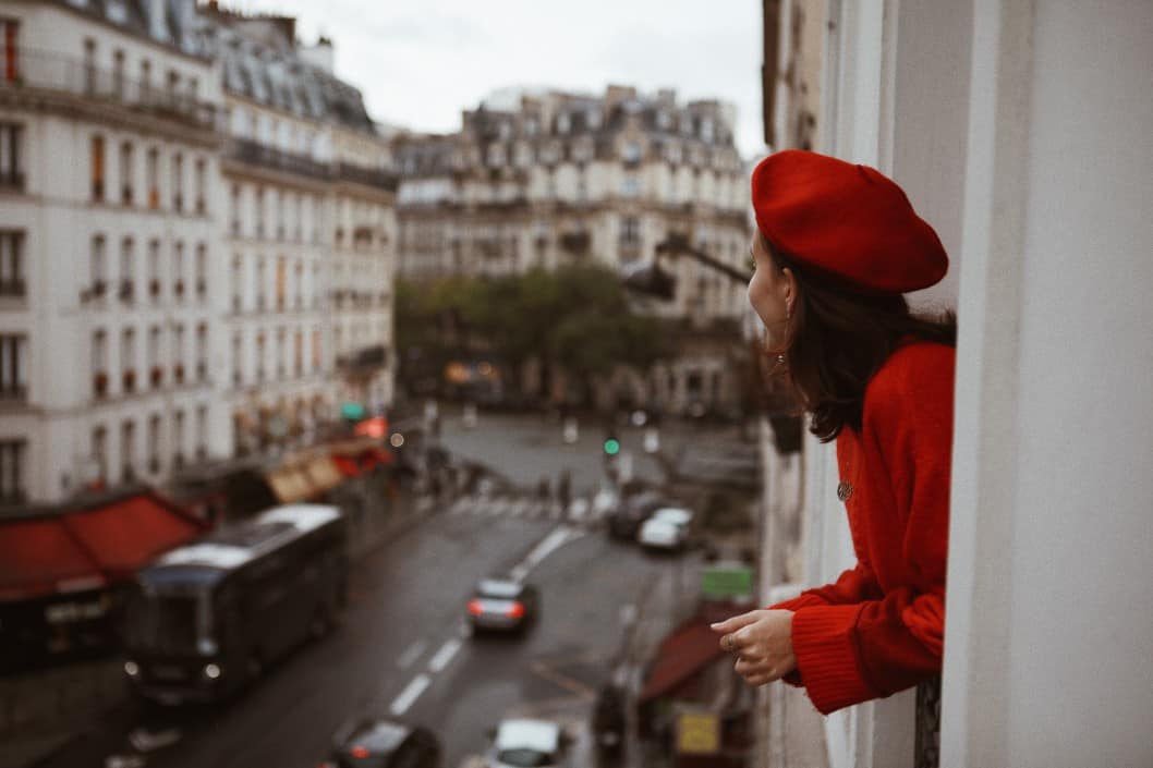 women bearing a red beret in Paris