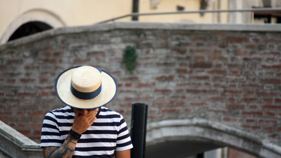 Man wearing a canotier hat