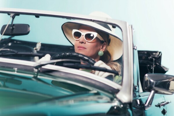 women wearing 1960s style glasses and hat