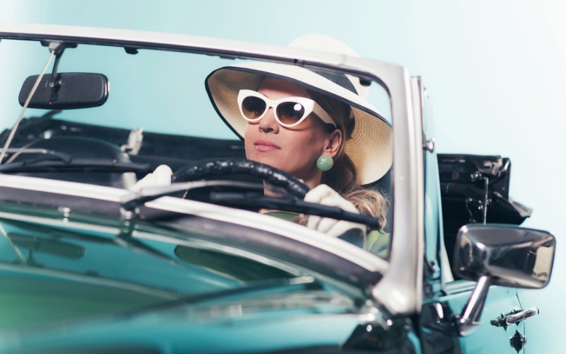 women wearing 1960s style glasses and hat