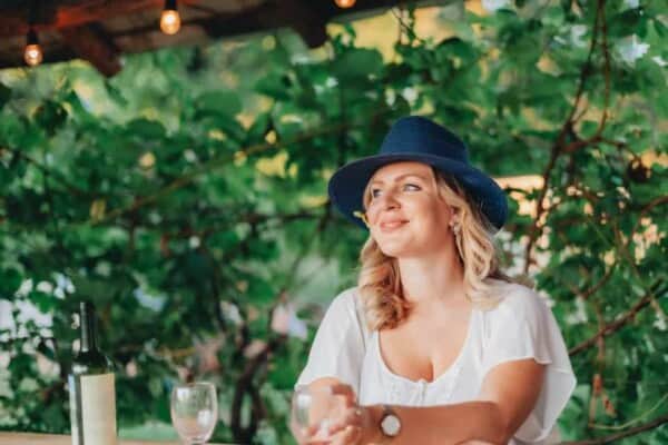 woman wearing a blue fedora