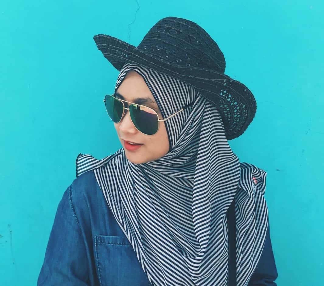 women wearing chic floppy hat with hijab