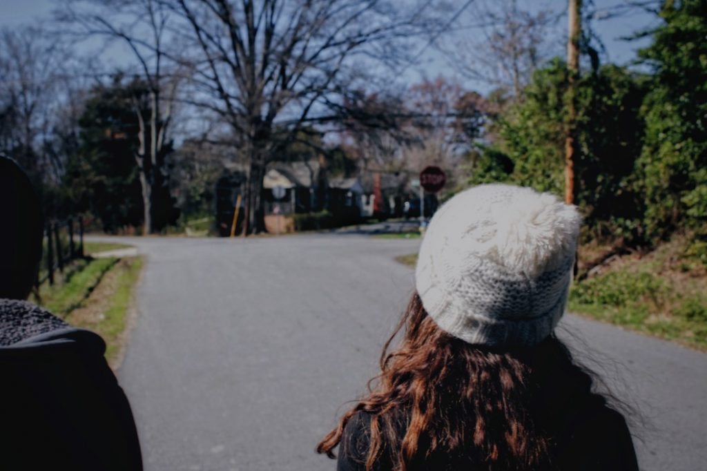 woman with thick hair wearing a beanie