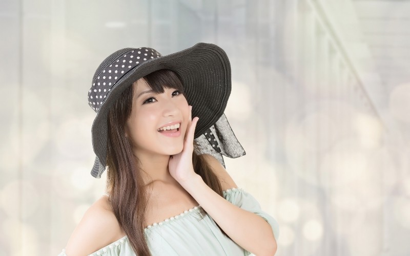 Chinese woman wearing a hat