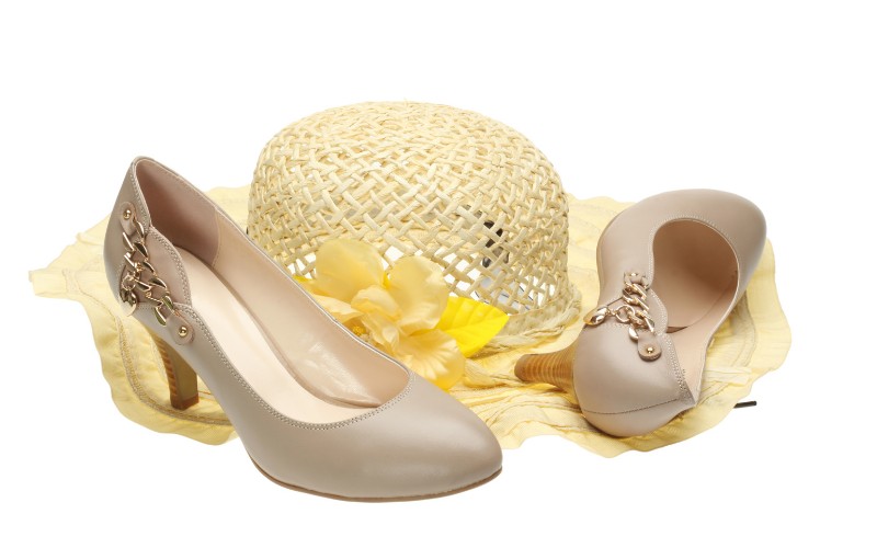 a straw hat and high heeled shoes