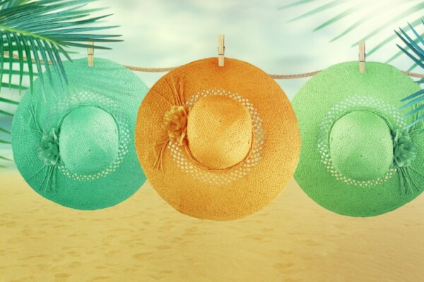 hats hanging to air on beach