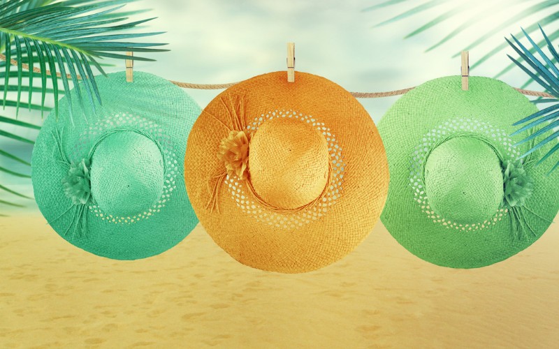 hats hanging to air on beach