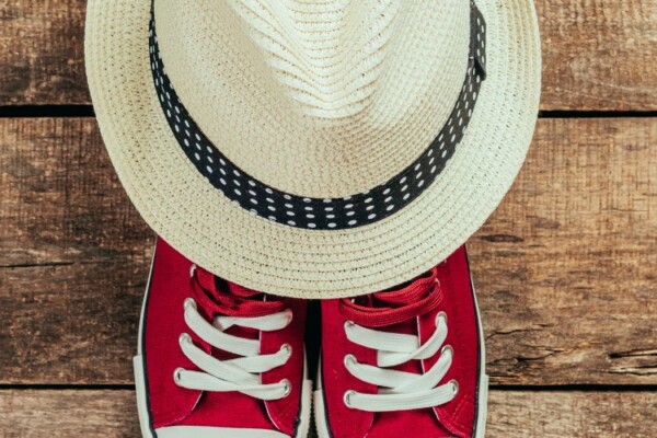 red sneakers and straw hat