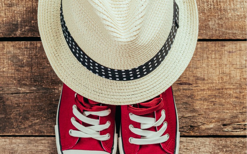 red sneakers and straw hat