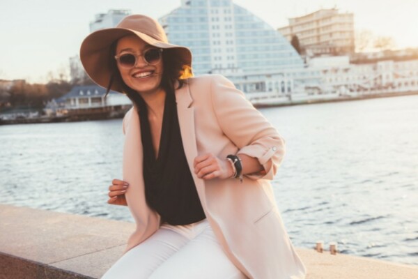 woman wearing hat on windy day