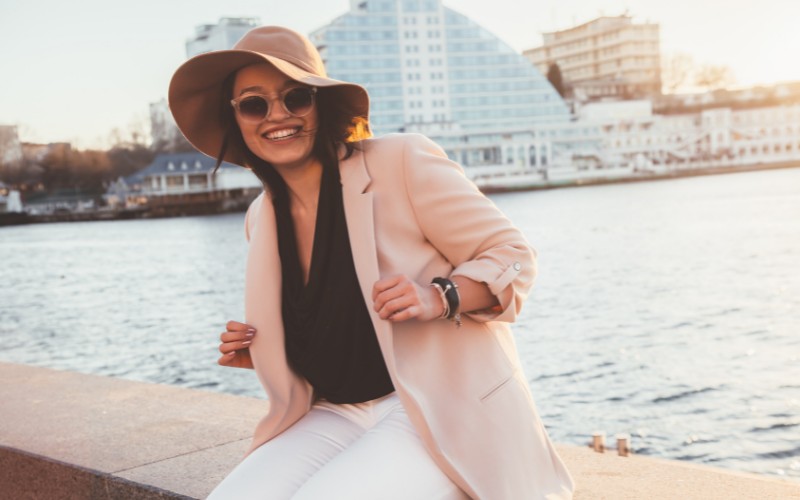 woman wearing hat on windy day