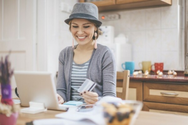 woman shopping online wearing a hat