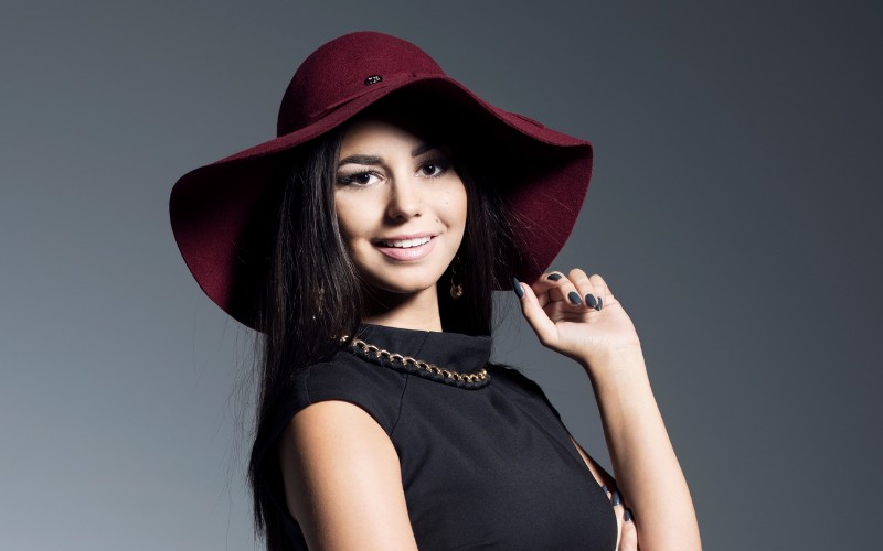 female model wearing a red hat