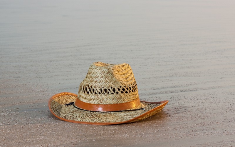 A wet hat on the beach