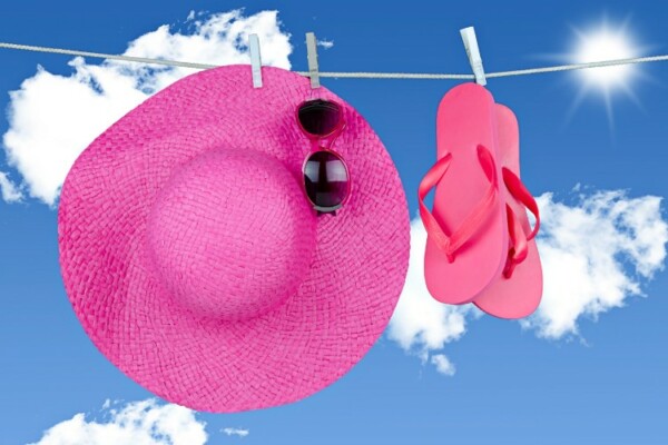 pink hat drying on clothes line