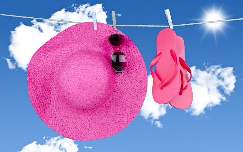 pink hat drying on clothes line