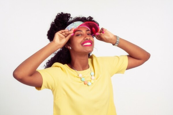 woman wearing a pink sun visor