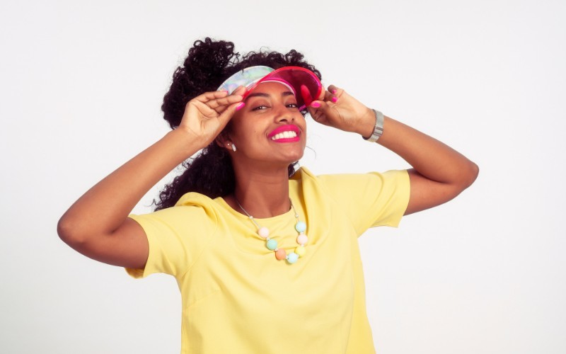 woman wearing a pink sun visor