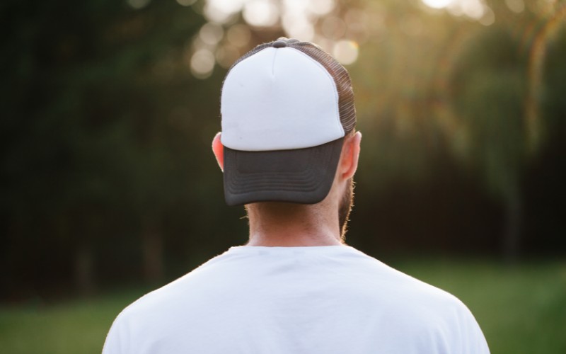 Man wearing a trucker hat backward