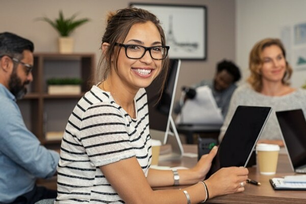 Workers in an office wearing business casual