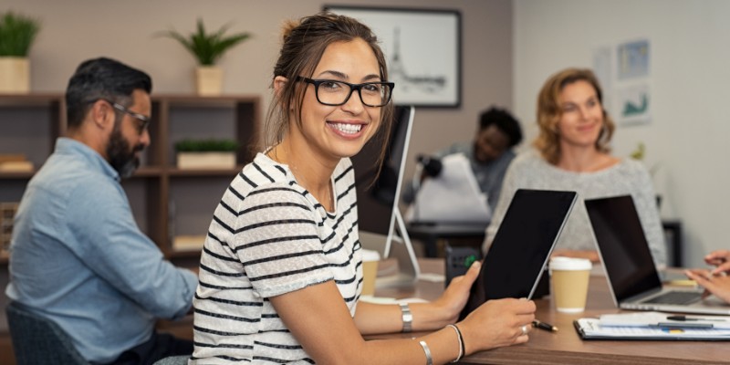 Workers in an office wearing business casual