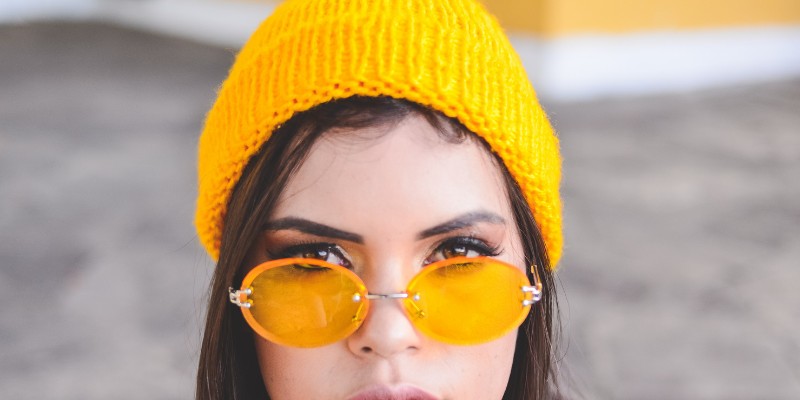 Woman wearing a beanie in the summer